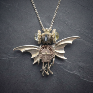 Handcrafted Avant-Garde Necklace - Mechanical Bird Skull Pendant with Sandalwood and Hand-Painted Glass Eyes.