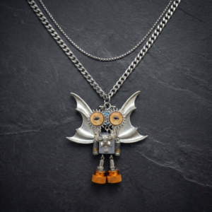 Handcrafted distressed silver Archive necklace with bio-mechanical avian and amber eyes.