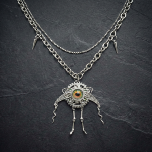 The Steel Sentry bio-mechanical necklace. Gear-shaped robot pendant with metal legs, micro-sprayed eye, and steel chain. Industrial grunge jewelry.
